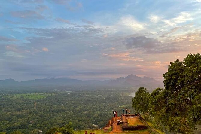 Day Trips from Kandy to Sigiriya with Village Experiences - Dambulla Cave Temple: 153 murals, Buddha statues, and rules you should follow